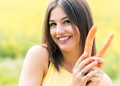 Ragazza con una carota